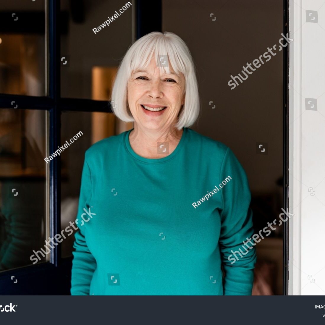 stock-photo-smiling-senior-woman-greeting-guest-retirement-home-doorstep-2514687401